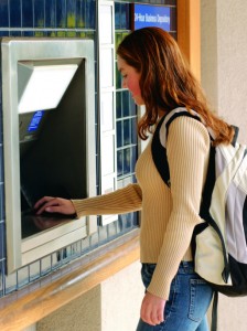 Photo, teenage girl with backpack at an ATM, Color, High res