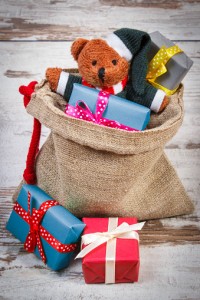 Teddy bear with colorful gifts for the holidays